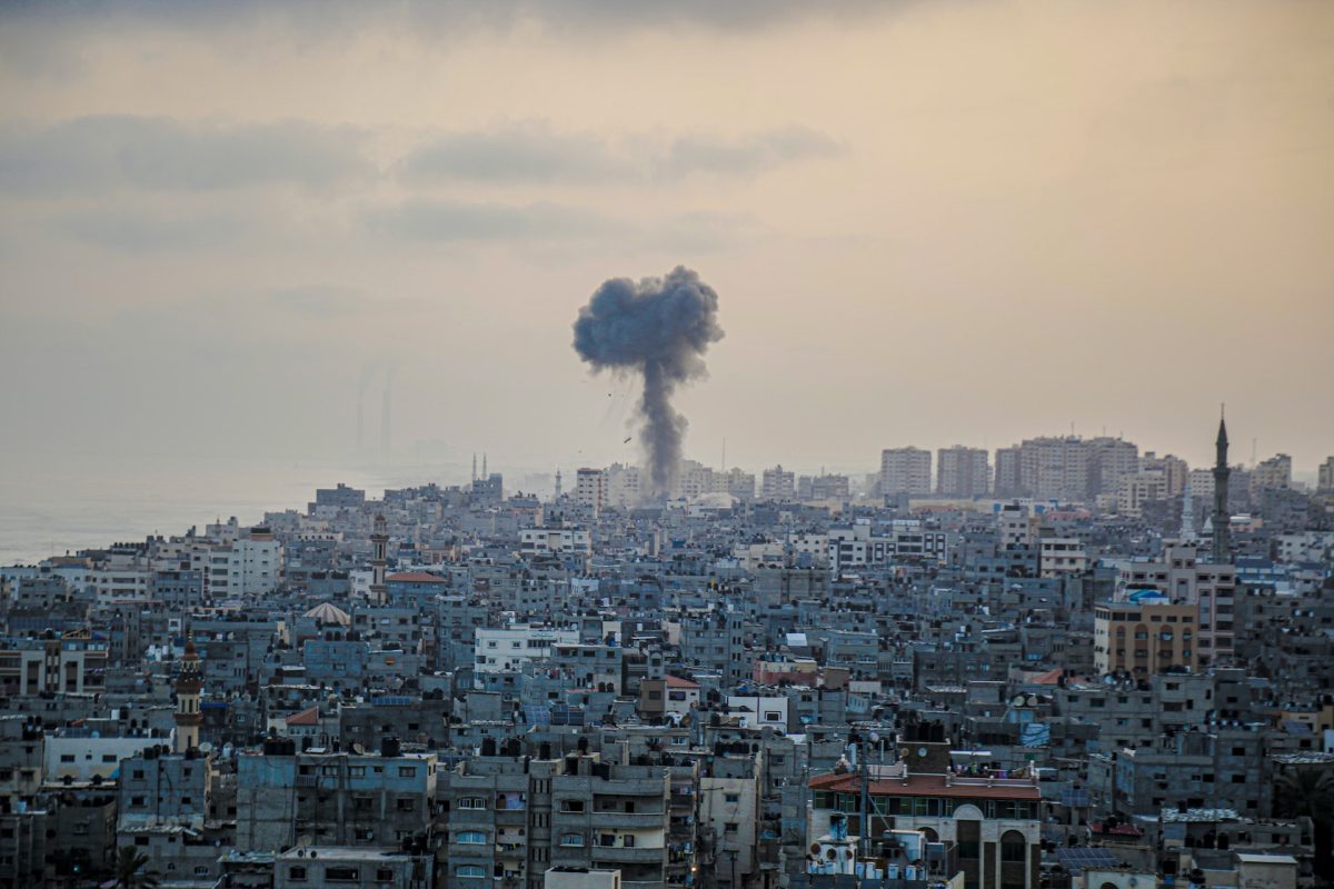 A column of smoke billows in the middle of the city from the Israeli bombing of the Gaza Strip.